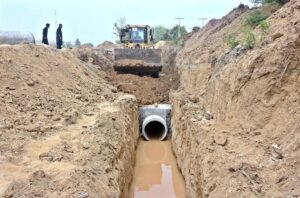 Heavy machinery is being used for the construction of bridge at the site of under construction 10th Avenue during development work in Federal Capital.