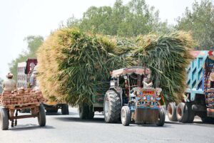 An overloaded tractor trolley on the way creating hurdle in the smooth traffic flow, need the attention of the concern authorities.