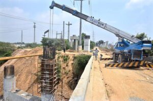 Heavy machinery is being used for the construction of bridge at the site of under construction 10th Avenue during development work in Federal Capital.
