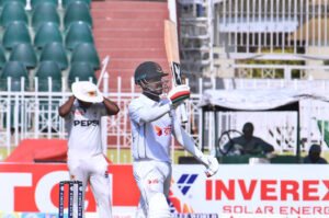 Bangladesh batsman Mehidy Hasan Miraz celebrates after scoring a half-century (50 runs) during the fourth day of the 1st Test Cricket Match playing between Pakistan and Bangladesh at Pindi Cricket Stadium.