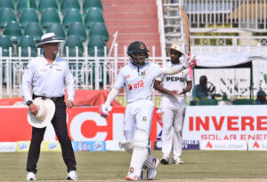 Bangladesh batsman Mehidy Hasan Miraz celebrates after scoring a half-century (50 runs) during the fourth day of the 1st Test Cricket Match playing between Pakistan and Bangladesh at Pindi Cricket Stadium.