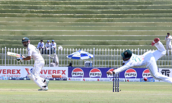 Bangladesh keeper dives to catch the ball during the second day of the last cricket Test match playing between Pakistan and Bangladesh at Pindi Cricket Stadium