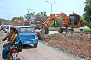 Heavy machinery is being used for the construction of bridge at the site of under construction 10th Avenue during development work in Federal Capital.