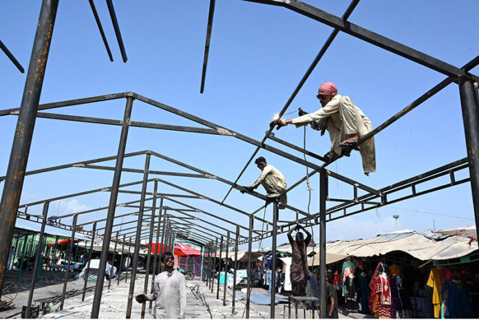 Rehabilitation work begins at Peshawar Mor Weekly Bazaar after extensive fire damaged and burned numerous stalls