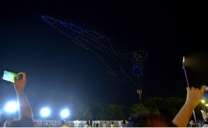 A large number of people witnessing the first Drone Light Show organized by Govt of Pakistan in the federal capital to commemorate the Independence Day at F-9 Park