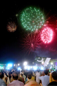 A large number of people attending firework celebration on the eve of Independence Day of Pakistan at F-9 Park