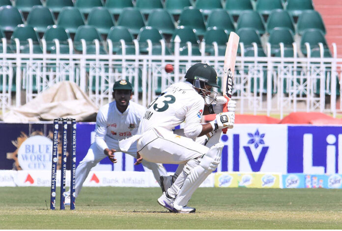 Pakistan batter Saim Ayub escapes of a bouncing ball during the second day of the last cricket Test match playing between Pakistan and Bangladesh at Pindi Cricket Stadium