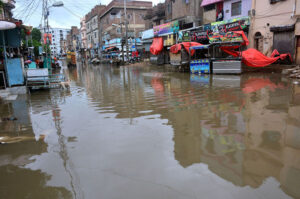 A flooded road in Latifabad Unit 02 after heavy rainfall leaves streets submerged
