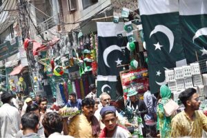 Vendors displaying national flags and other stuff in connection with upcoming Independence Day celebrations in Provincial Capital