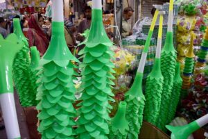 Shopkeepers displaying the different stuff related to Independence Day at Urdu Bazar as the nation starts preparations to celebrate Independence Day in befitting manners.