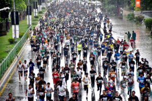 A large number of participants take part in the Azadi Marathon 2024, a 12KM race celebrating Pakistan's 77th Independence Day, organized by the Youth Affairs & Sports Department.