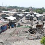 A view of the workers busy rebuilding the stalls at the Peshawar Mor Weekly Bazaar, which was damaged due to a fire