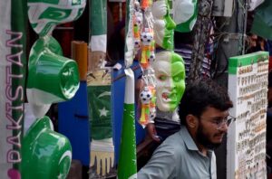 Shopkeepers displaying the different stuff related to Independence Day at Urdu Bazar as the nation starts preparations to celebrate Independence Day in befitting manners.