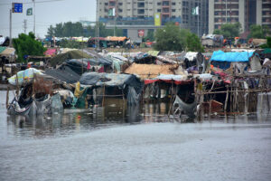 A flooded road in Latifabad Unit 02 after heavy rainfall leaves streets submerged
