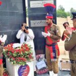 District Police Officer Abdullah Ahmad offering fateha at Yadar-e-Shuda in front of DPO office on the eve of Youm-e-Shuda Police