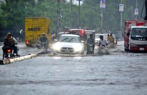 Vehicles passing through rainwater accumulated on the Kalma Chowk Road during heavy monsoon rain in the city.