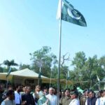 Divisional Commissioner Madam Silwat Saeed flanked by Regional Police Officer (RPO) Dr Abid Khan, Deputy Commissioner (DC) Abdullah Nayyar Sheikh, City Police Officer (CPO) Kamran Adil and former parliamentarian Hajji Akram Ansari is hoisting national flag during a ceremony at commissioner complex to inaugurate the Independence Day celebrations