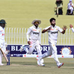 Pakistan players celebrate after dismissing Bangladesh's Mominul Haque during the third day of the 1st Test match at Pindi Cricket Stadium in the twin cities