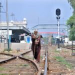 Pakistan Railway maintenance worker inspect and repair railway tracks ,ensuring safety and preventing potential mishaps near the railway station