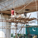 Labourers in construction work of bridge at Chel Chauk