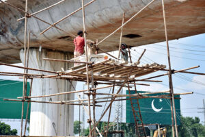 Labourers in construction work of bridge at Chel Chauk