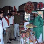 Visitors are viewing at displayed items during a Craft Exhibition arranged at Faisalabad Arts Council in connection with 77th Independence Day celebrations
