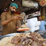 Vendor selling and displaying traditional Kabli Pulao to attract the customers here at Kabli Gate
