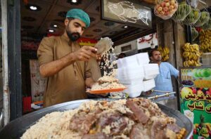 Vendor selling and displaying traditional Kabli Pulao to attract the customers here at Kabli Gate