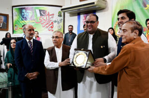 Provincial Law Minister Sohaib Ahmad Bherth, Shafaqt Abbas, Asim Naseer, Begum Safhia Ishaq, and others participate in the prize distribution ceremony for children who competed in Independence Day speech contests, organized by the Nazaria-i-Pakistan Trust.