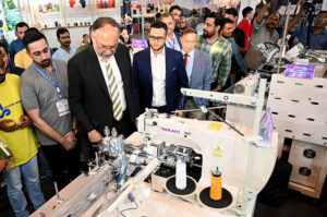 Federal Minister for Planning and Development, Ahsan Iqbal cutting ribbon to inaugurate Textile Asia Exhibition at Expo Center