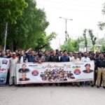 SSP Dr. Farukh Ali along with other police officials and business community participating in a walk to mark Youm-e-Shuhada Police at Court Road