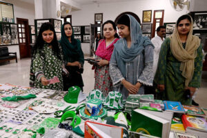 Women visiting stalls during ceremony in connection with Independence Day organized by the Nazaria-i-Pakistan Trust.