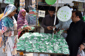 Student create a vibrant national flag at Alhamra Arts Council's summer camp for Independence Day.