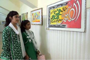 Young Girls are visiting calligraphic exhibition at Sargodha Arts Council during celebration of Independence Day