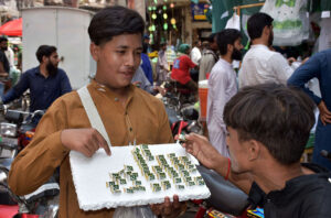 Student create a vibrant national flag at Alhamra Arts Council's summer camp for Independence Day.