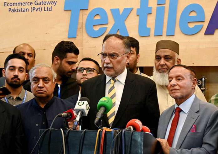 Federal Minister for Planning and Development, Ahsan Iqbal cutting ribbon to inaugurate Textile Asia Exhibition at Expo Center