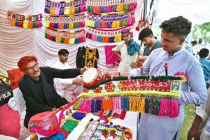 Devoted visitors enjoy a leisurely boat ride during the 281st Urs celebrations at the shrine of Hazrat Shah Abdul Latif Bhitai with devotion and festive spirit.