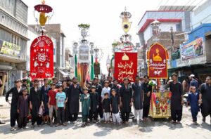 Mourners attending the Chehlum procession to commemorate the martyrdom of Hazrat Imam Hussain (RA) the grandson of Holy Prophet Muhammad (PBUH).