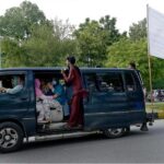 A big-sized national flag placed on a van to mark the Independence Day celebrations
