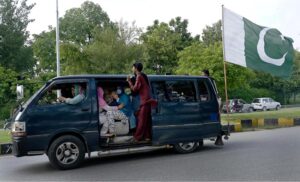 A big-sized national flag placed on a van to mark the Independence Day celebrations
