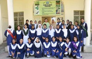 Students of Model College for Girls I-8/4 are planting saplings in connection with Independence Day.
