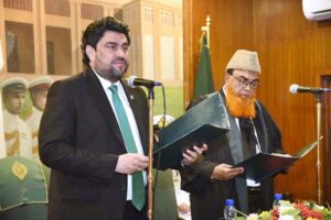 Governor Sindh Kamran Khan Tesori is taking the oath of office of Acting Chief Justice of Sindh High Court from Senior Justice Naimatullah Phulpoto during a ceremony at Governor House.