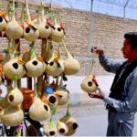 A street vendor sells handmade bird nests for garden aimed the upcoming breeding season of birds in the region