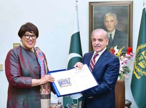 Secretary General of the, Commonwealth H.E. Ms Patricia Scotland, presenting Charter of the Commonwealth to Prime Minister Muhammad Shehbaz Sharif.