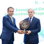 Prime Minister Muhammad Shehbaz Sharif presenting a memento to Waqas ul Hassan, CEO Karandaaz at the inaugural ceremony of Buna-Raast Connectivity Project Implementation Phase