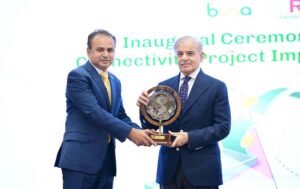 Prime Minister Muhammad Shehbaz Sharif presenting a memento to Waqas ul Hassan, CEO Karandaaz at the inaugural ceremony of Buna-Raast Connectivity Project Implementation Phase