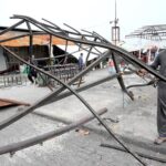 CDA workers work on restoring stalls after the fire at H-9 weekly bazaar in the Federal Capital