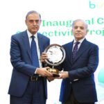 Prime Minister Muhammad Shehbaz Sharif presenting a memento to Governor State Bank Jameel Ahmed at the inaugural ceremony of Buna-Raast Connectivity Project Implementation Phase