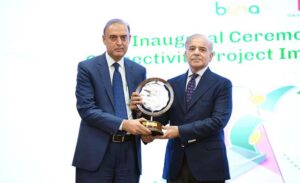 Prime Minister Muhammad Shehbaz Sharif presenting a memento to Governor State Bank Jameel Ahmed at the inaugural ceremony of Buna-Raast Connectivity Project Implementation Phase