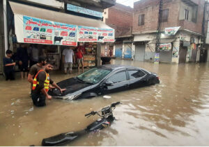 A delivery truck is stranded in a flooded road, underscoring the city's failing drain system as record-breaking rains hit the Provincial Capital.